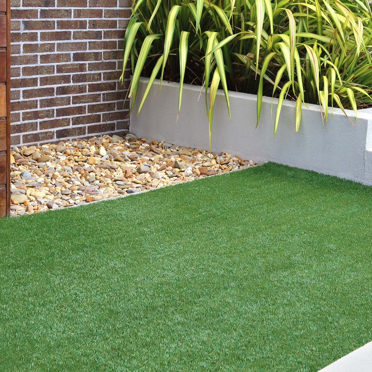 Combination of timber, plants, rocks, artificial grass, brick and render wall