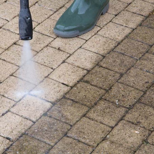Outdoor floor cleaning with high pressure water jet